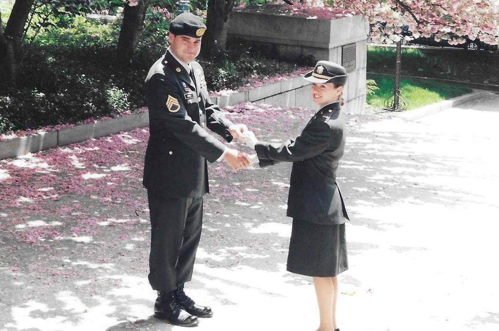 Anna Hohler, MD (CAMED’98), receives her first coin and salute from her brother Staff Sergeant Gerald DePold in 1995.