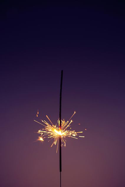 firework sparking in dark sky like a star