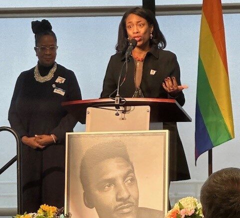 Dr. Cassandra Pierre standing behind podium
