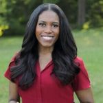 Christine Crawford outside with grass and trees behind her