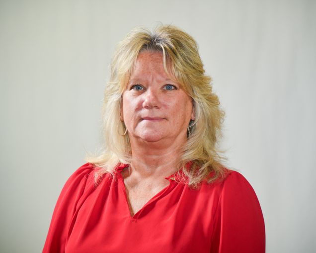 head and shoulders image of michelle hamm wearing red top
