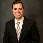 Nicholas DiPersio dark suit, light shirt, broad smile