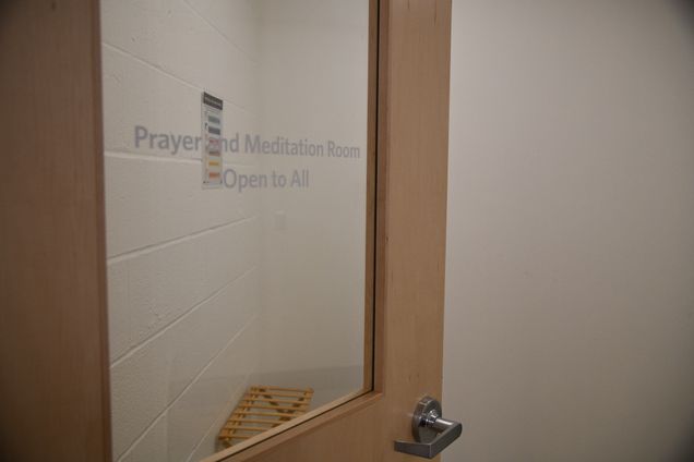 view of meditation room through glass panel door that states paryer and Meditation Room