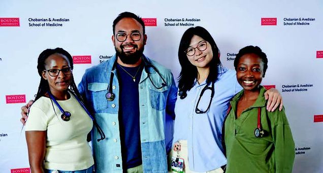 Medical students posing with their new stethoscopes: (l-r), Tess Perkins, Nick Hernandez, Yukino Nakamura, and Marcia Ndege.