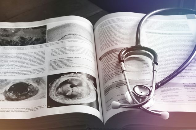 photo of open magazine with stethoscope on top