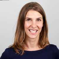 Britta Lassmann headshot, smiling broadly