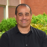 Scott Harris head and shoulders shot outside of Instructional building