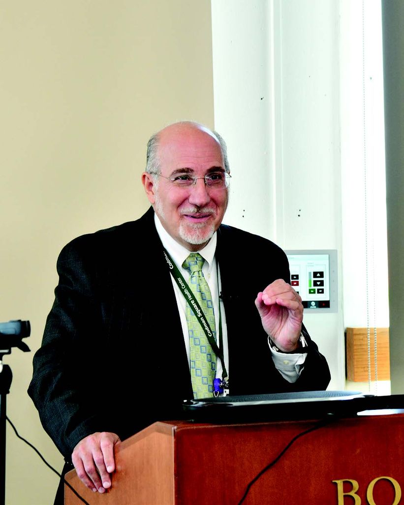 Keynote speaker Stephen Tringale (CAMED’90), assistant professor of family medicine and Codman Square Health Center medical director standing at dais and talking