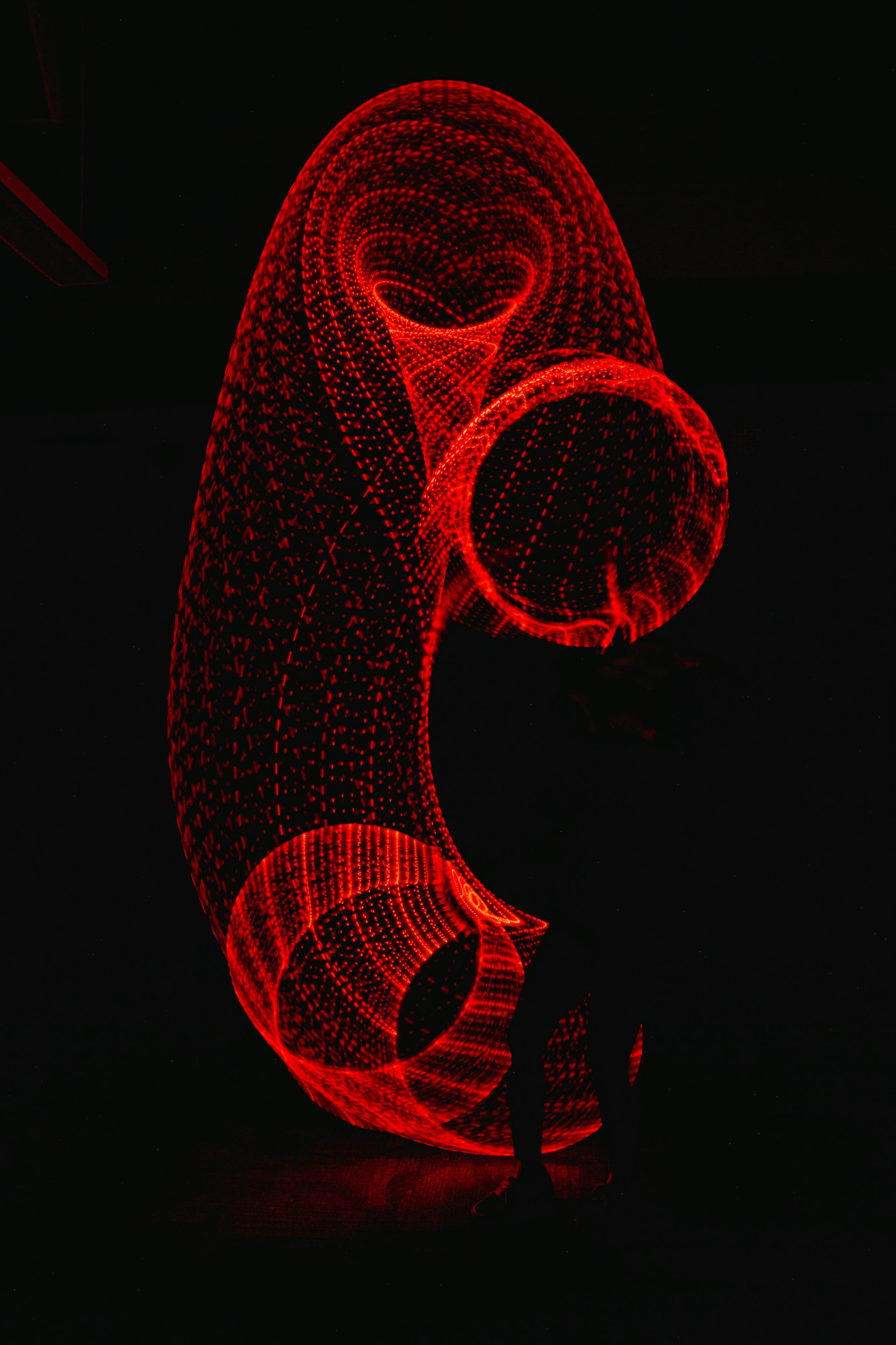 3D image of red heart on black background Photo by Zach Lucero on Unsplash