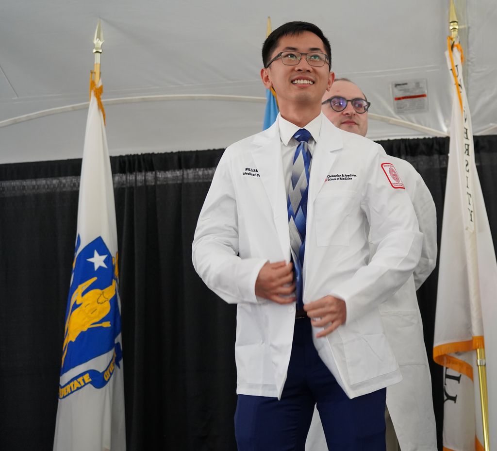 William Wang receives whitecoat