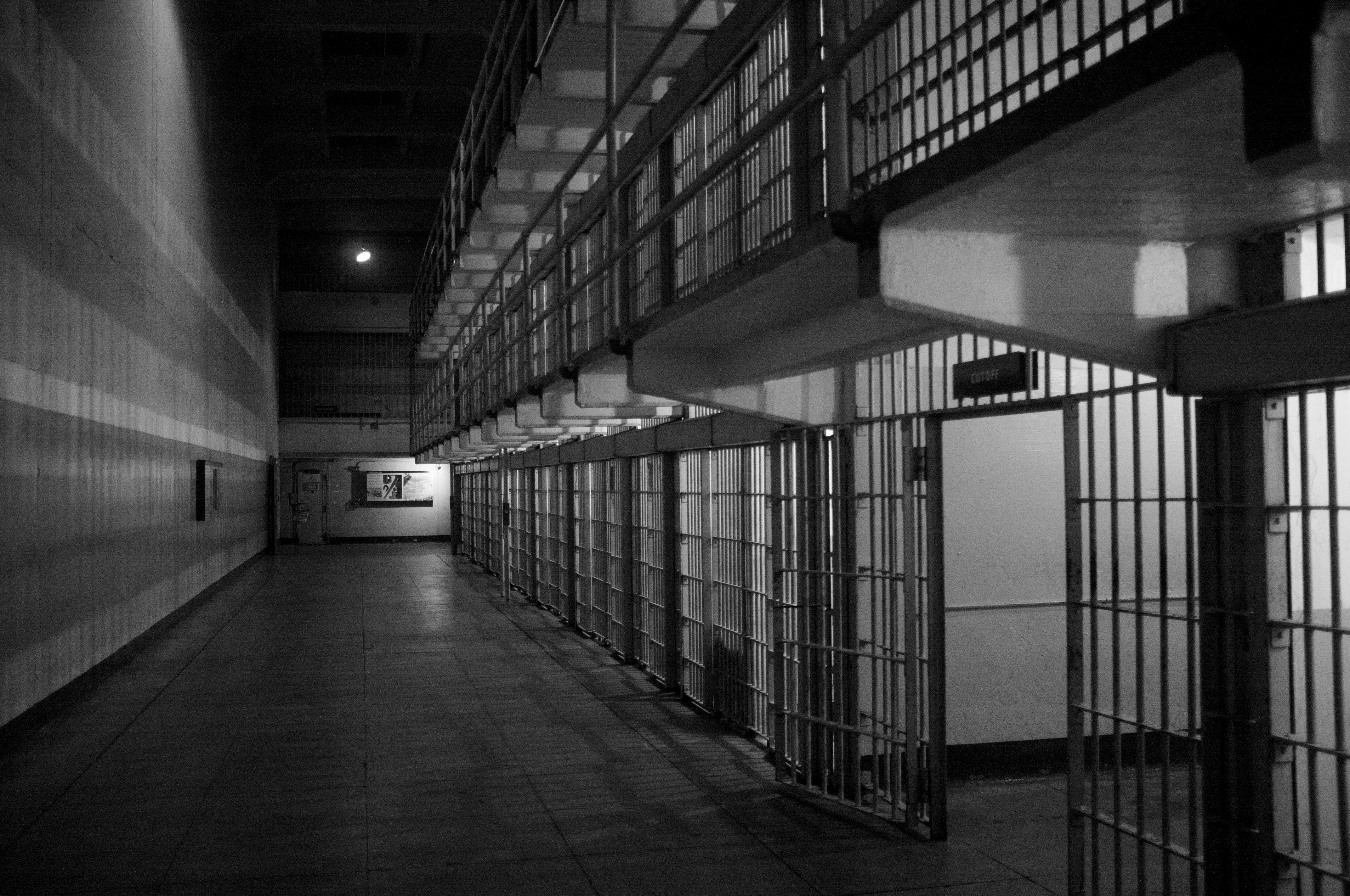 black and white image of prison cells