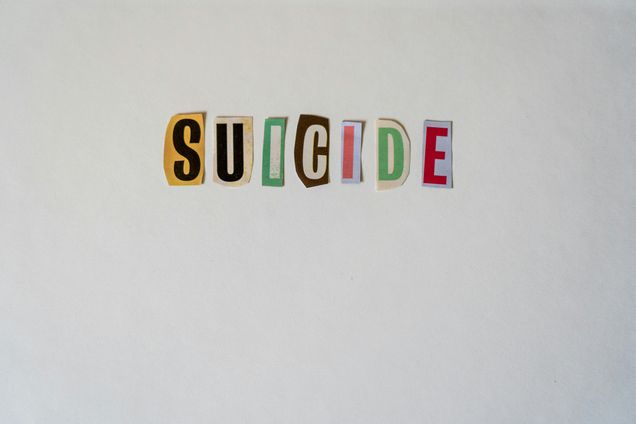 cut out letters spelling suicide