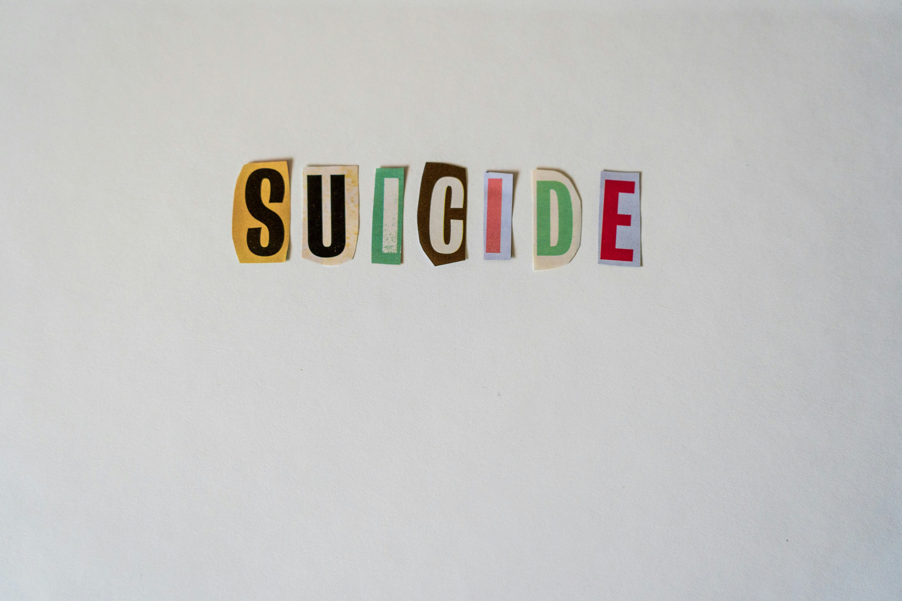 cut out letters spelling suicide