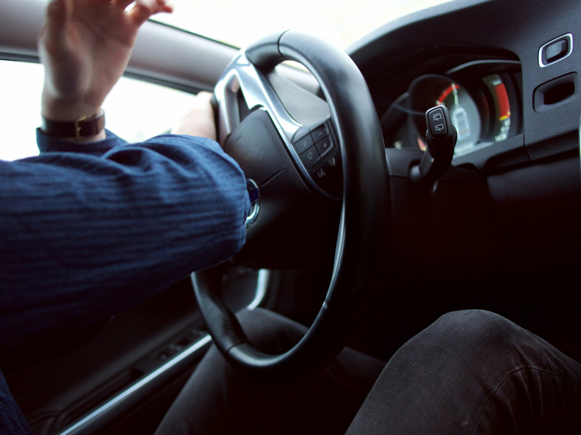 Man holding steering wheel.