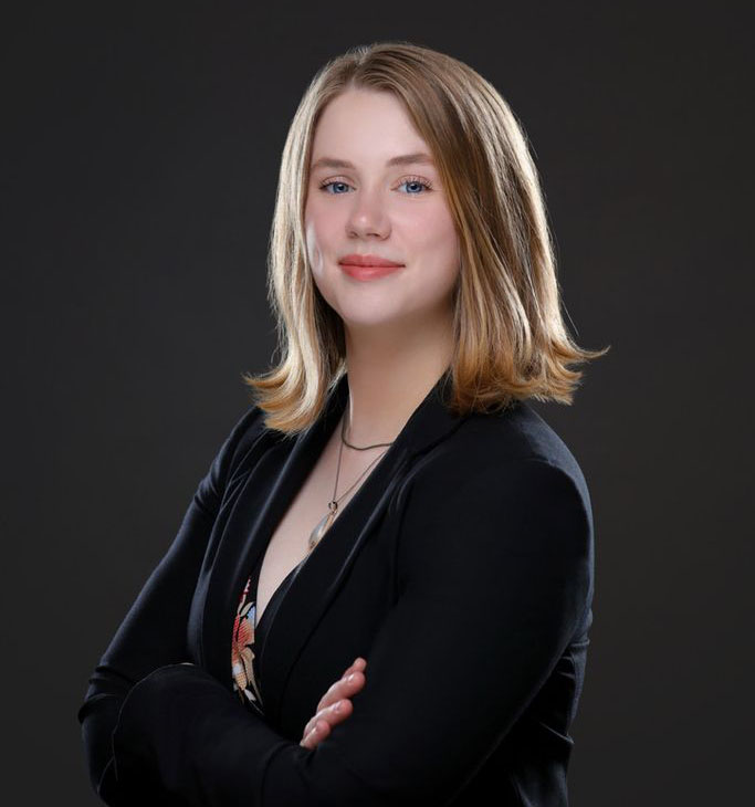 Portrait of Brenna Hagan wearing dark jacket