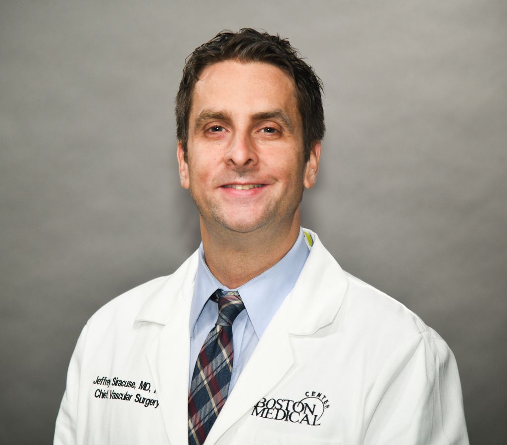 Dr. Siracuse wearing his whitecoat