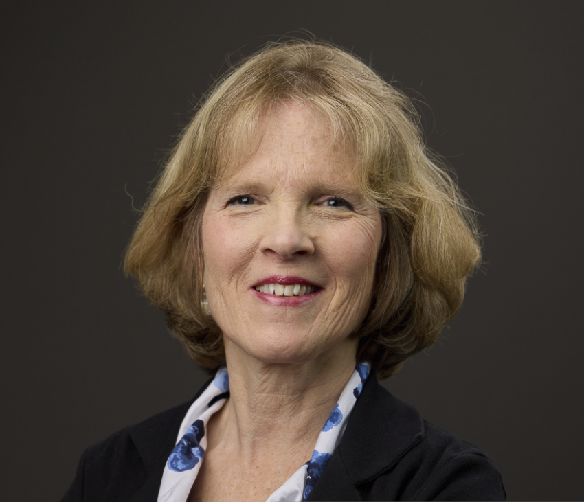 Katharine Canfield headshot chin length blond hair, blue jacket