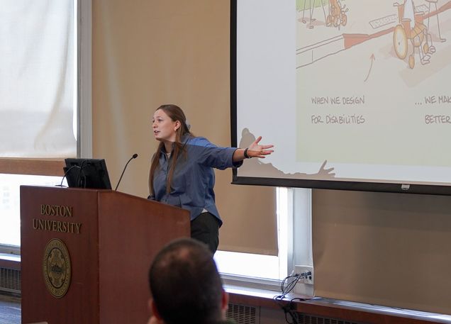 woman presenting at podium