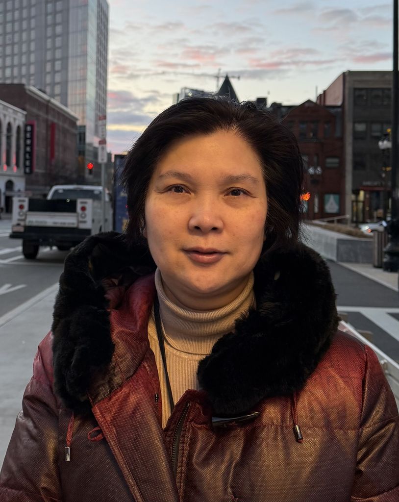 Head and shoulders image of Xueling Wu outside, smiling gently