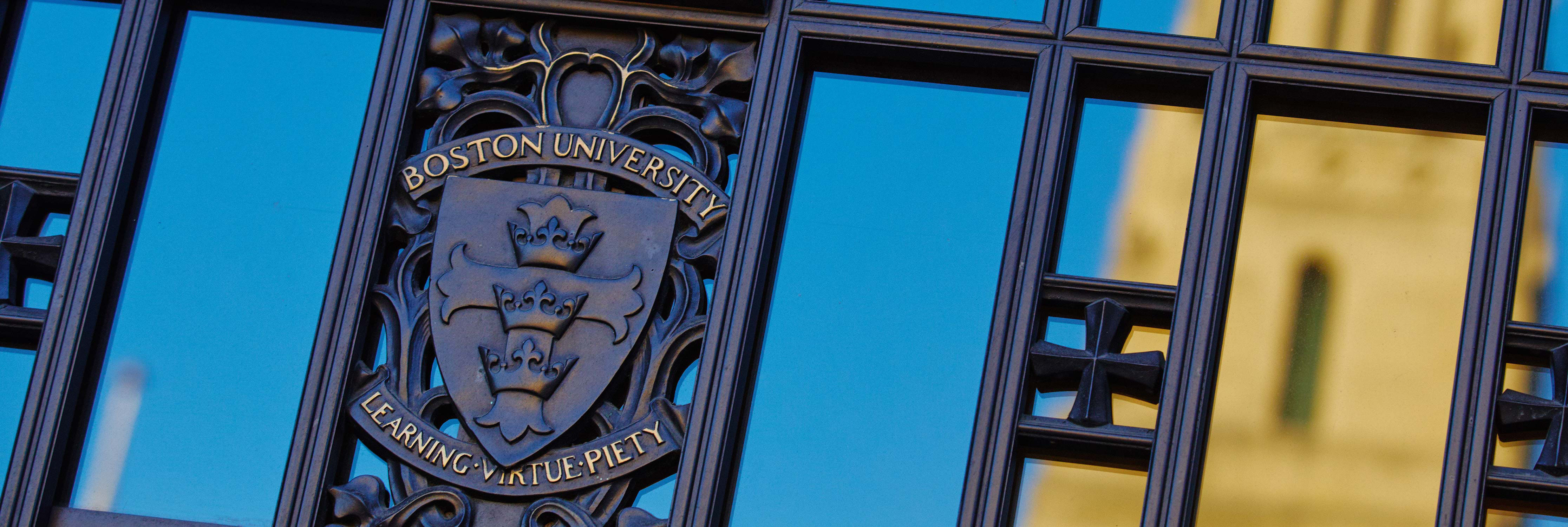 Gate with BU insignia learning virtue piety