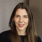 woman with long brown straight hair smiling