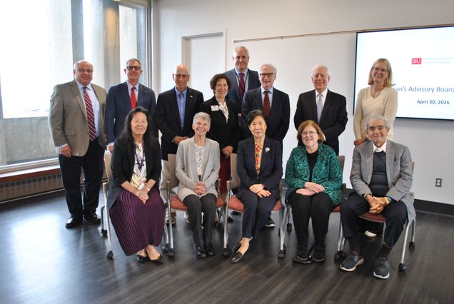 The Dean's Advisory Board, a group of people posing for the camera
