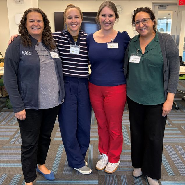 Four women standing together