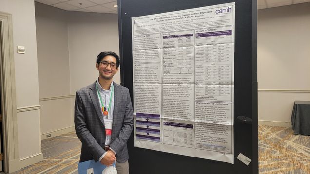 Victor Tang presents his poster at CPDD