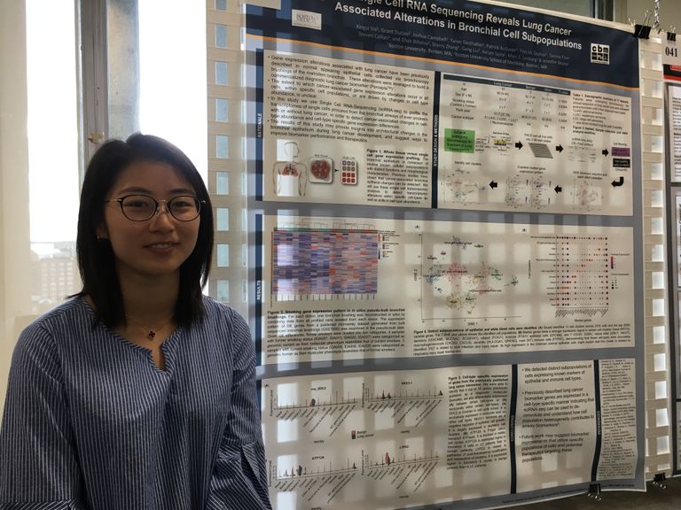 graduate student Xingyi Shi presenting a poster at Evans Day