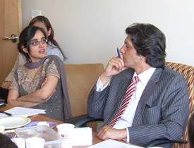 Anita Raj (left) meets with members of a delegation from Pakistan to discuss gender-based violence.