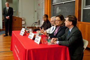 10-2853-SPHLECTURE-010 SPH Dean Robert F. Meenan (MED’72, GSM’89) (standing) and a Bicknell lecture panel discuss medicine’s runaway costs. Photos by Kalman Zabarsky