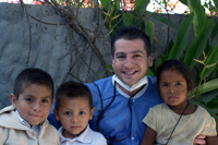Teacapan-200 Mission supervisor Frank Schiano with some of the children treated in Teacapan
