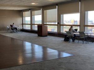 Hiebert Lounge with two study tables physically distanced with one person at each table