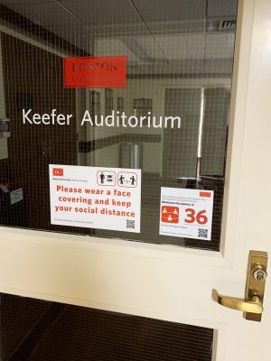 Keefer Auditorium door showing maximum occupancy