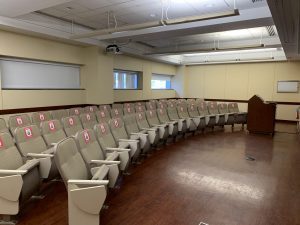 Classroom R 105 empty with signs on seats to indicate social distancing