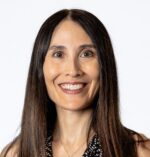 Woman with long brown straight hair smiling broadly