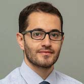 man with eyeglasses, dark hair on head and facial hair