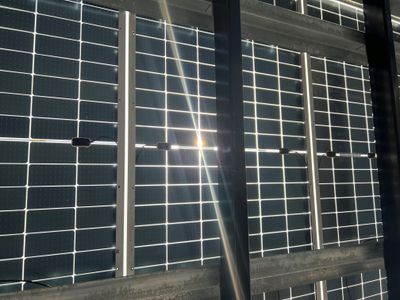 Solar panel with sunlight streaming through