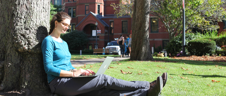 student studying outside on campus