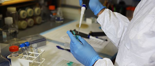 Student pipetting in lab