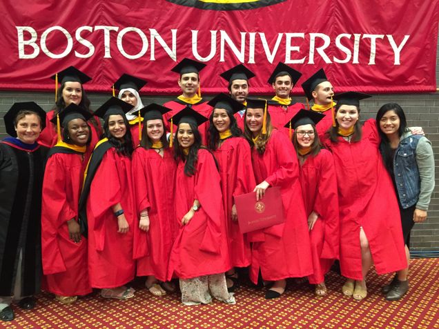 students and faculty at graduation