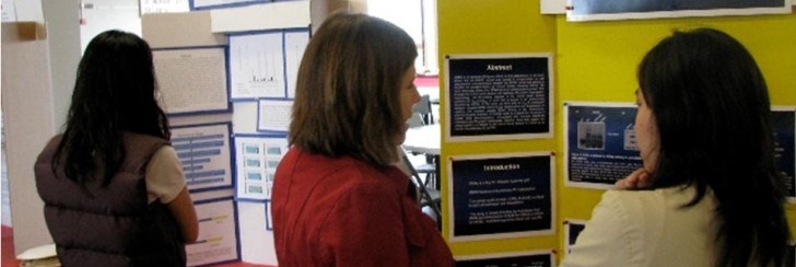 Students and teacher at poster presentation