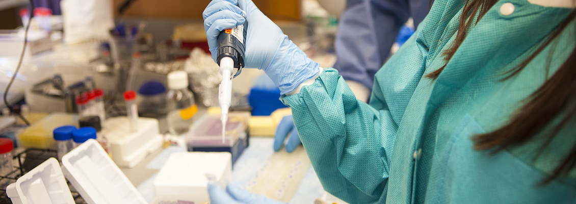 Student pipetting in lab