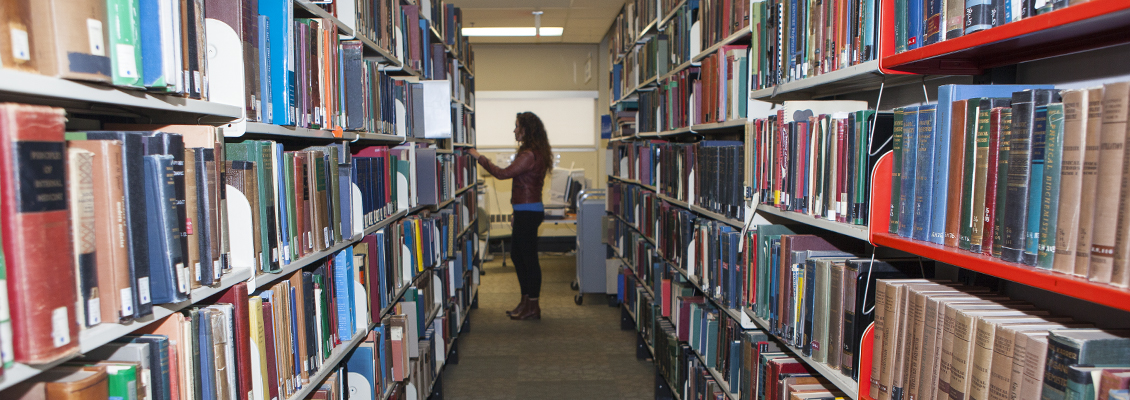 student in library