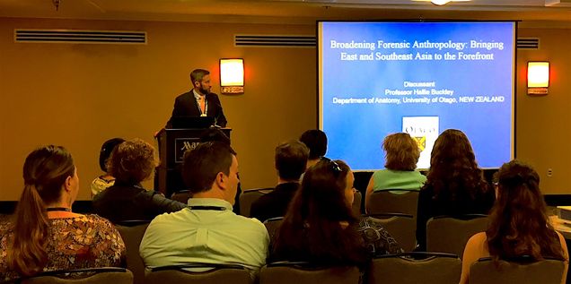 man giving a presentation to a group of students