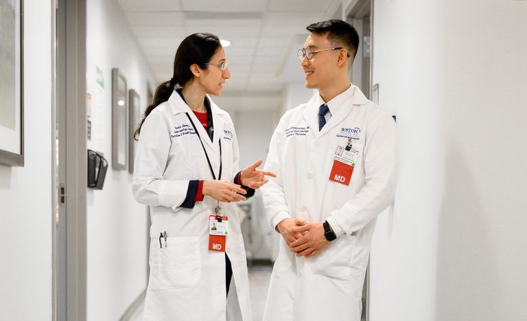 Physicians talking in hallway