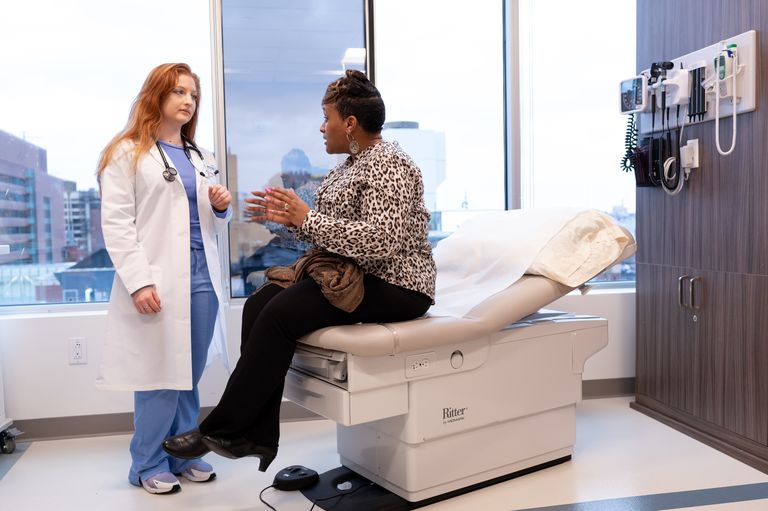 Clinician speaking with patient