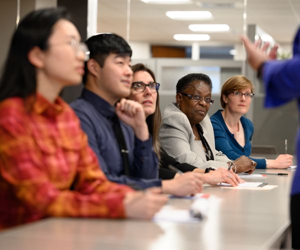 Staff attending a lecture or meeting