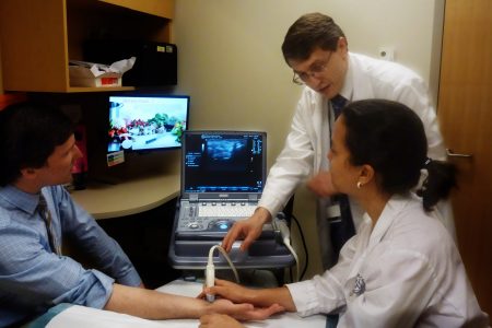 Dr. Gene Kissin providing instruction on ultrasound examination