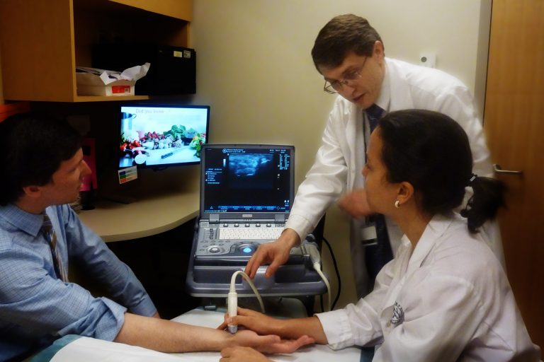 Dr. Gene Kissin providing instruction on ultrasound examination